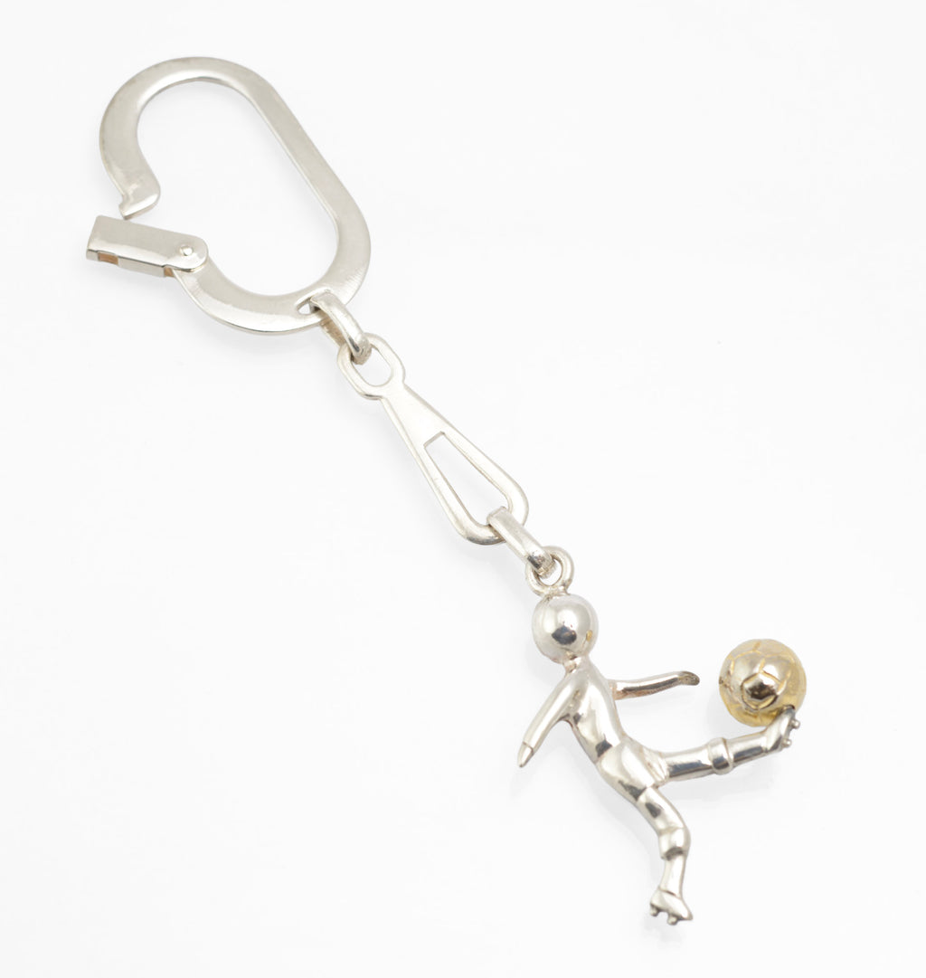Close view of the broad hinged spring clip on a vintage Italian sterling silver footballer keyring