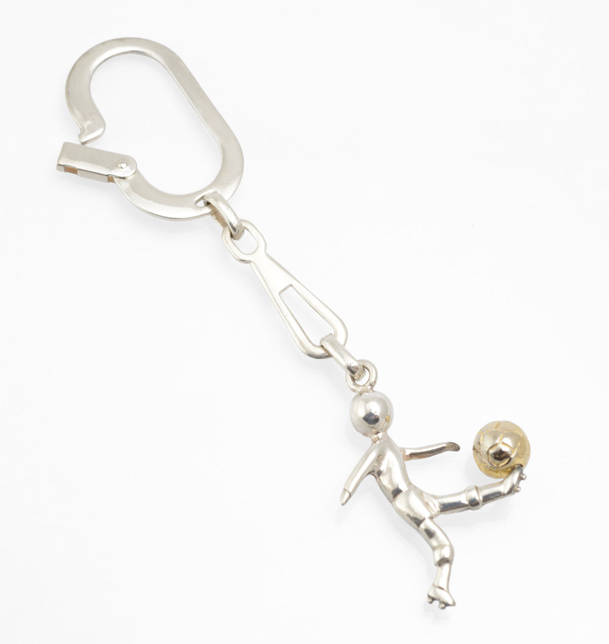 Close view of the broad hinged spring clip on a vintage Italian sterling silver footballer keyring