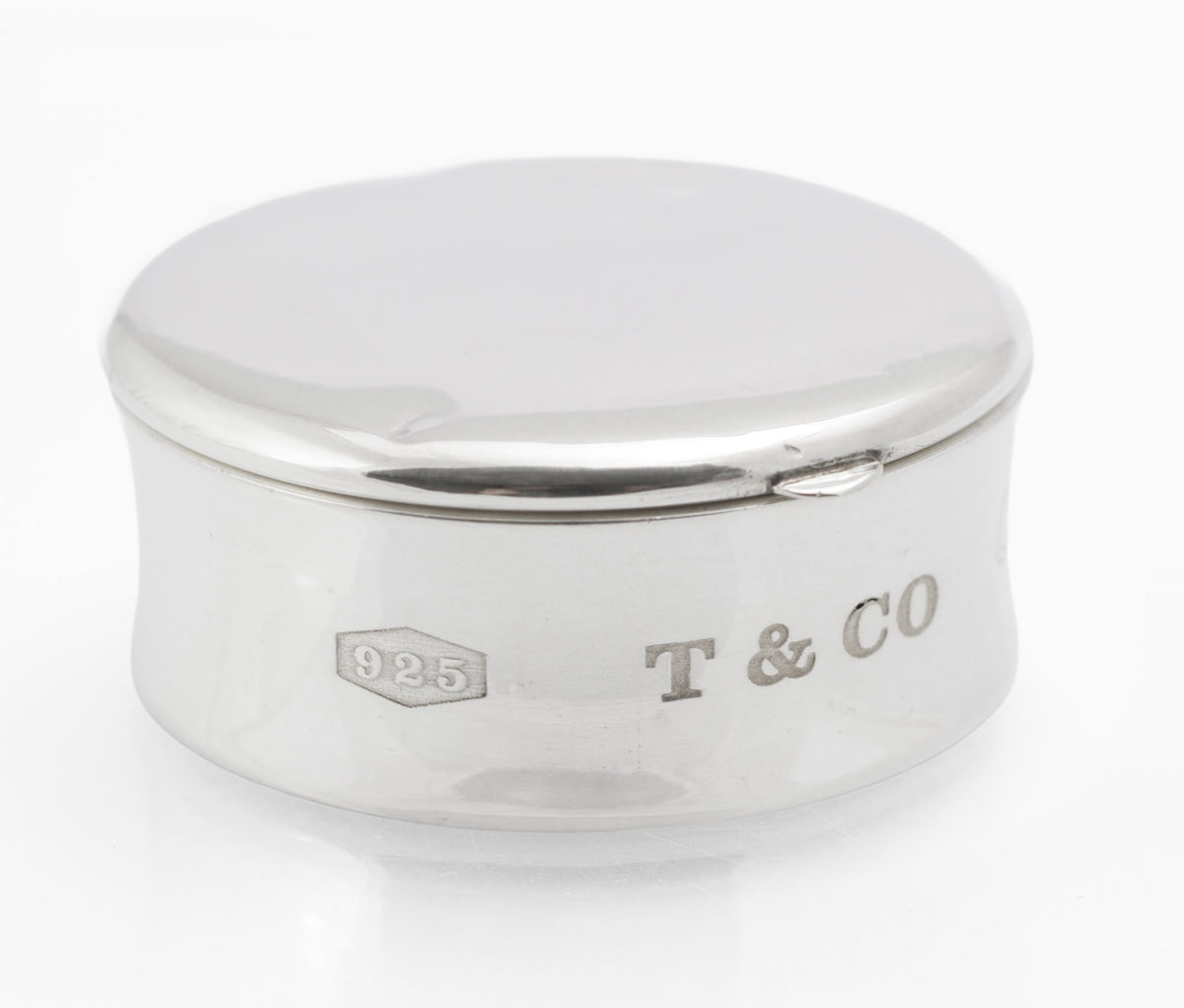 Side marks reading 925 and T & Co on the vintage Tiffany & Co sterling silver pill box