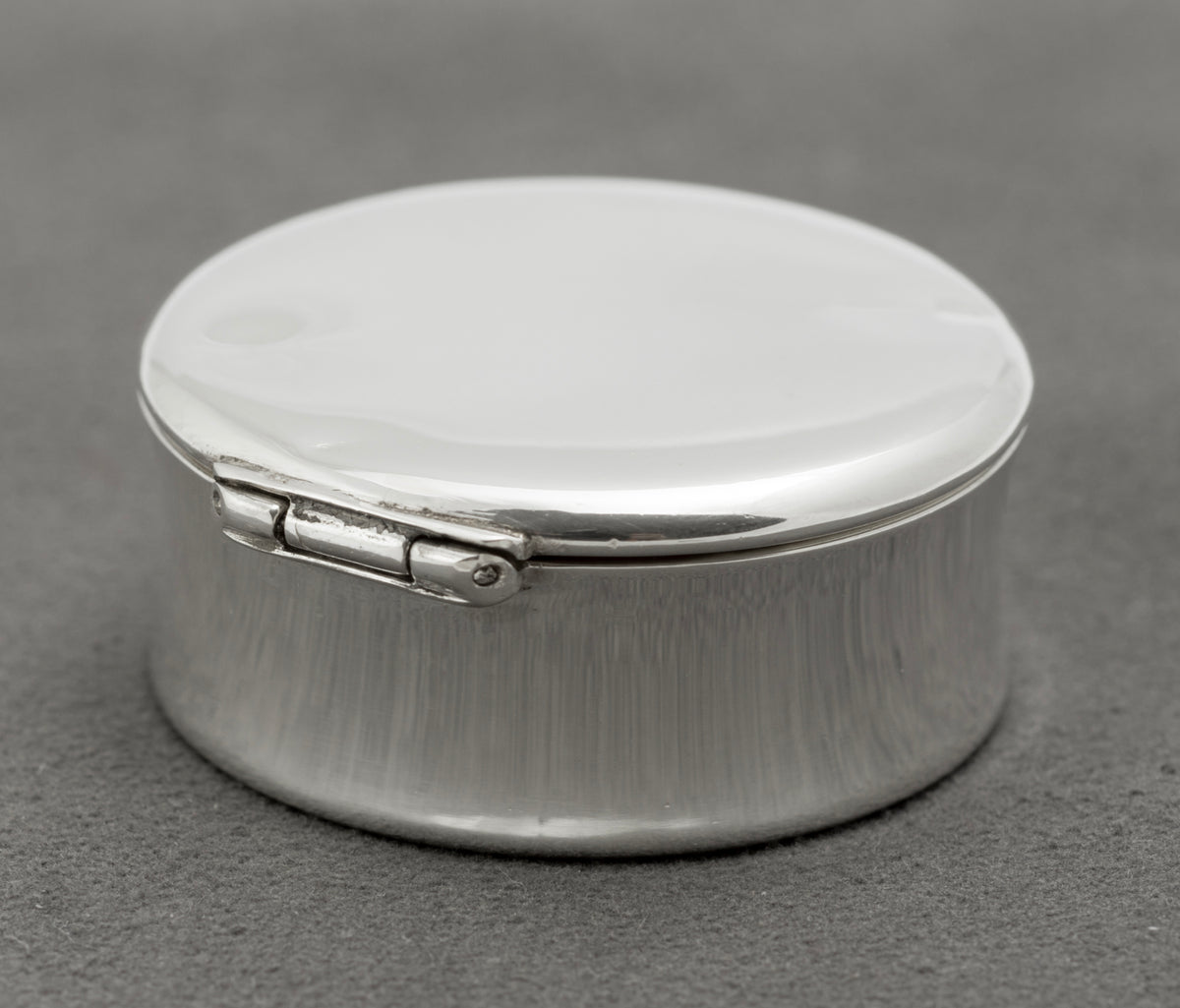Close view of the working hinge on the vintage Tiffany & Co sterling silver pill box
