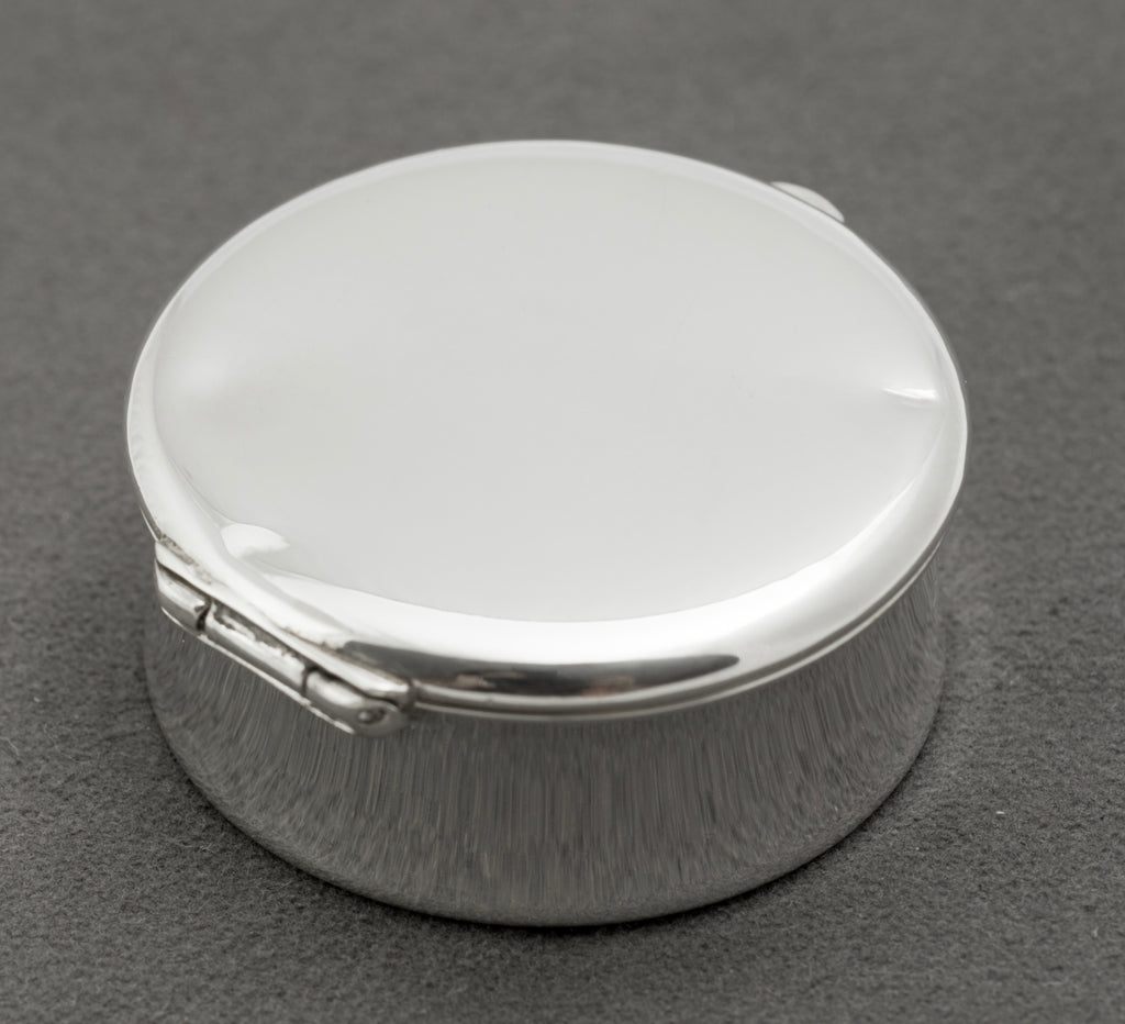 Top view of the flat lid on a vintage Tiffany & Co sterling silver 1837 pill box