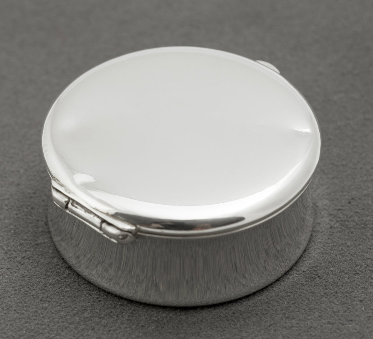 Top view of the flat lid on a vintage Tiffany & Co sterling silver 1837 pill box