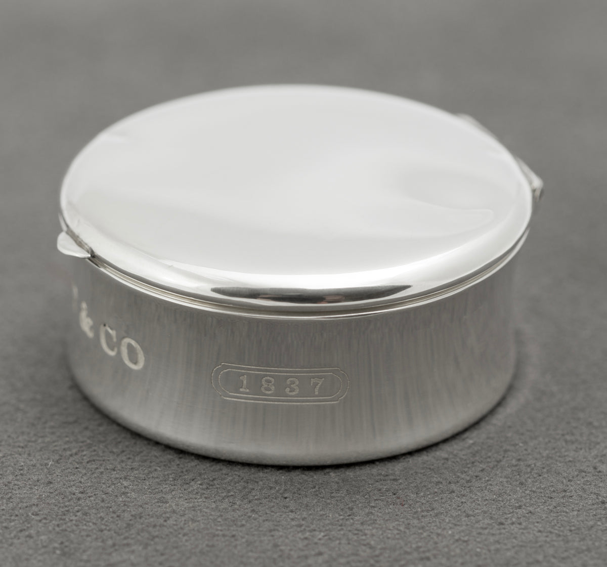 Side view showing the 1837 collection mark on the sterling silver Tiffany & Co pill box