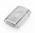 Small Victorian sterling silver vesta case with chased foliate decoration, vacant cartouche and ribbed striker