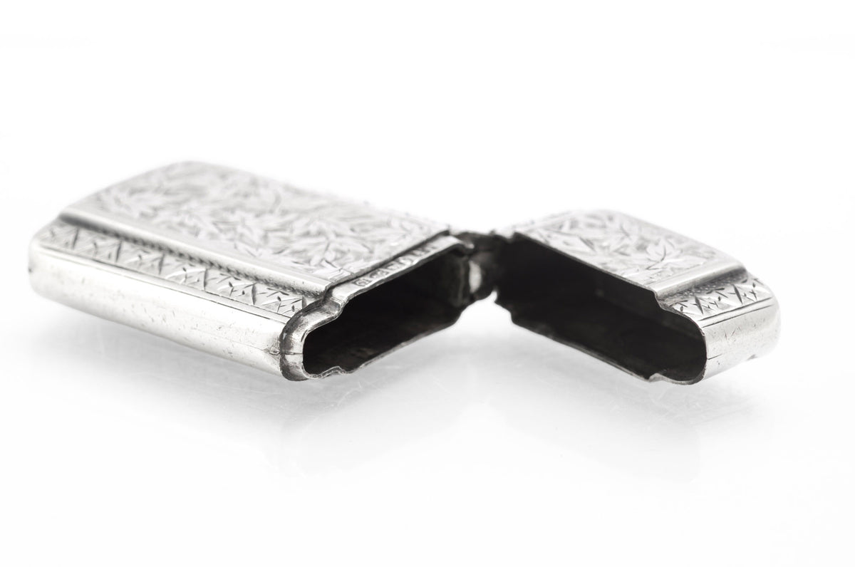 Victorian sterling silver vesta case opened to show the hinged cap and case interior