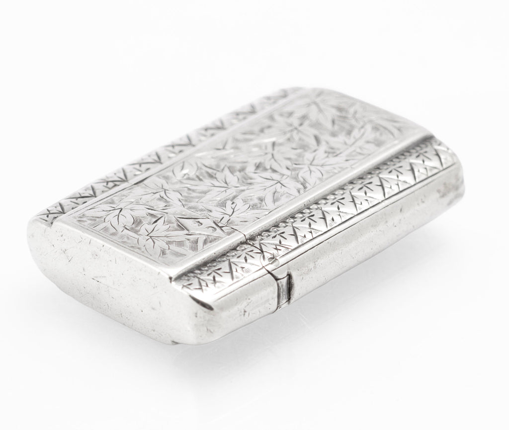 Closed antique Victorian sterling silver vesta case with foliate decoration and vacant cartouche
