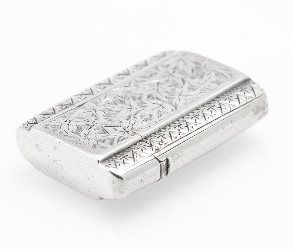 Closed antique Victorian sterling silver vesta case with foliate decoration and vacant cartouche