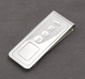 Vintage sterling silver money clip by Harrison Brothers and Howson Ltd showing the Birmingham hallmarks and maker's mark FGH