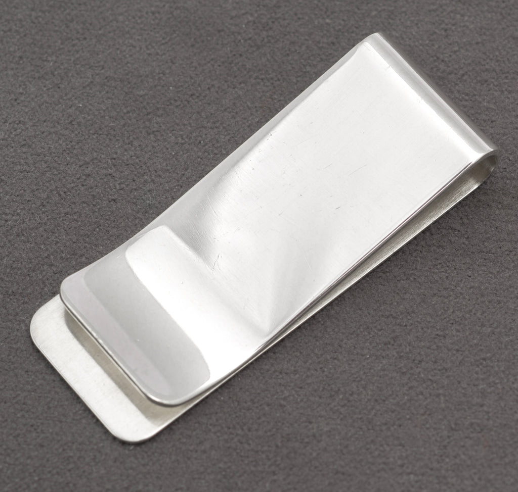 Front view of vintage sterling silver money clip with broad polished face and softly rounded corners