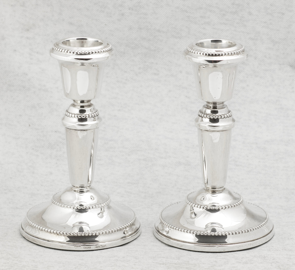 Detail showing the W I Broadway and Co maker mark and Birmingham hallmarks on the silver candlestick