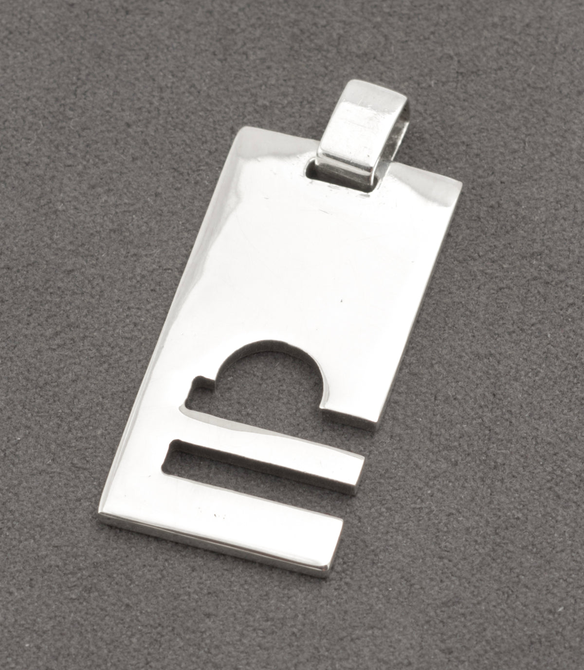 Gucci silver Libra pendant at an angle showing the broad integral loop and marks - C3110