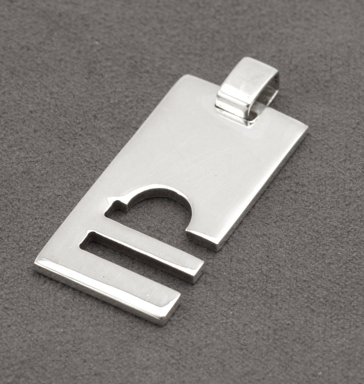 Marked side of Gucci sterling silver Libra pendant showing GUCCI Made in Italy stamp and LIBRA engraving - C3110