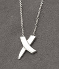 Reverse of Tiffany Kiss pendant marked Tiffany & Co, 925 and Paloma Picasso signature - C3111