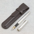 Vintage Links of London silver plated fountain pen beside its original brown leather pouch