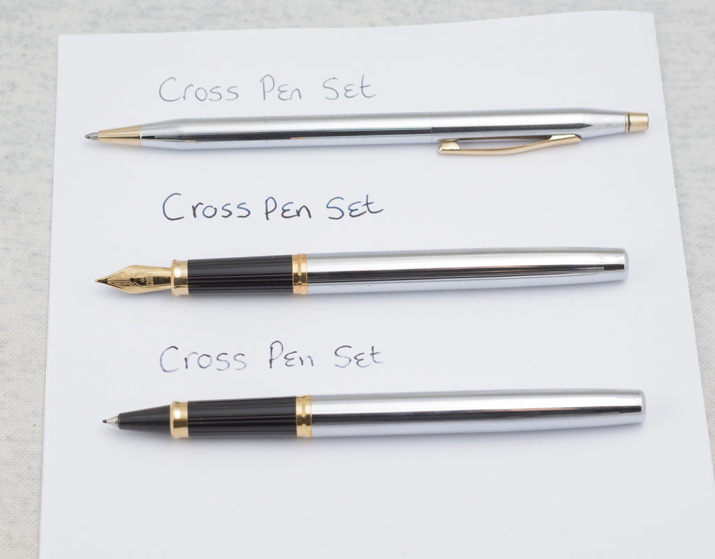 Three Cross Medalist writing instruments laid out separately showing the chrome and gold tone finishes