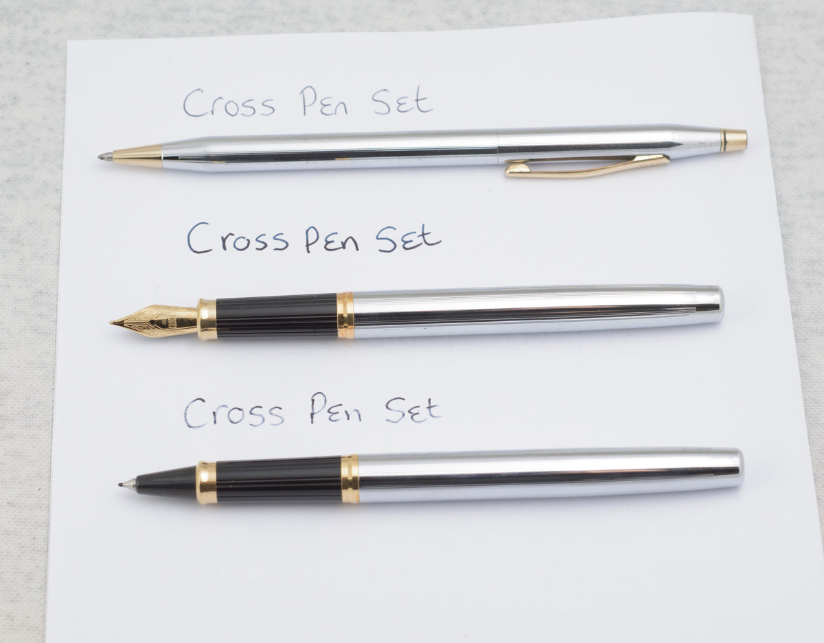 Three Cross Medalist writing instruments laid out separately showing the chrome and gold tone finishes