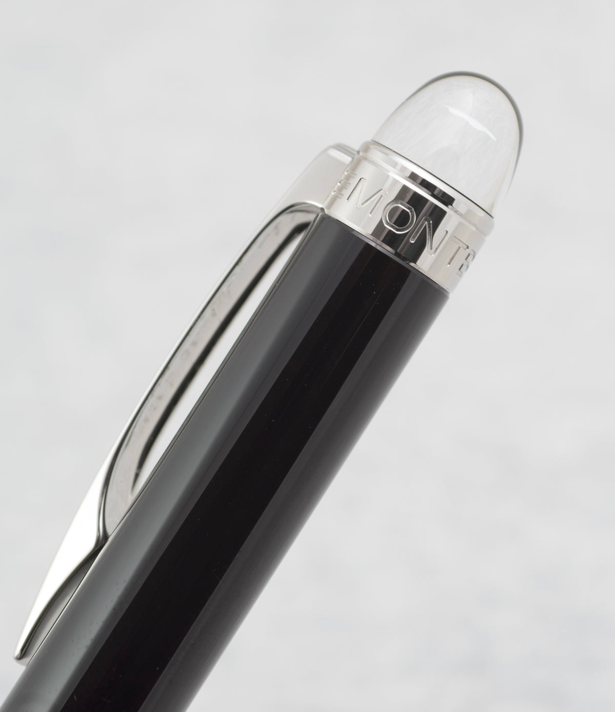 Close view of the clear domed Montblanc StarWalker finial and platinum plated pocket clip