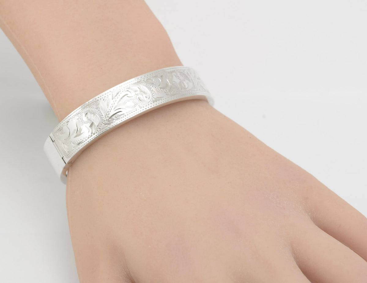 Side view of the sterling silver bangle worn on a display hand