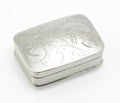 Closed sterling silver pill box by Joseph Smith & Sons, showing its softly rounded rectangular shape