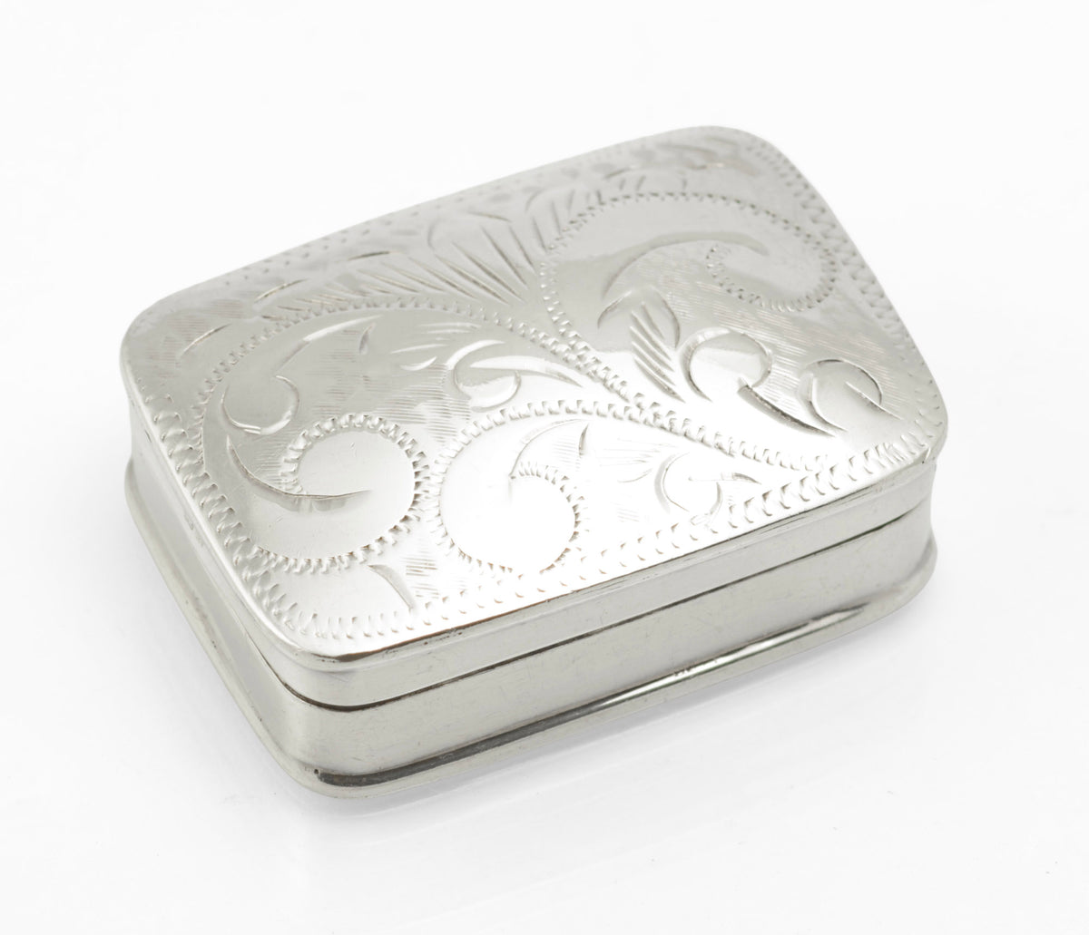 Closed sterling silver pill box by Joseph Smith & Sons, showing its softly rounded rectangular shape