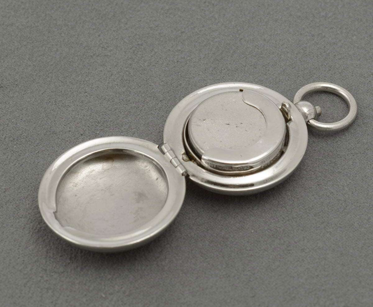 Front of the holder with its coloured PORTRUSH enamel souvenir shield and suspension ring