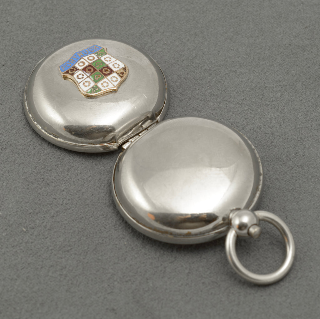 Open sovereign holder showing the hinged case and internal coin carrier