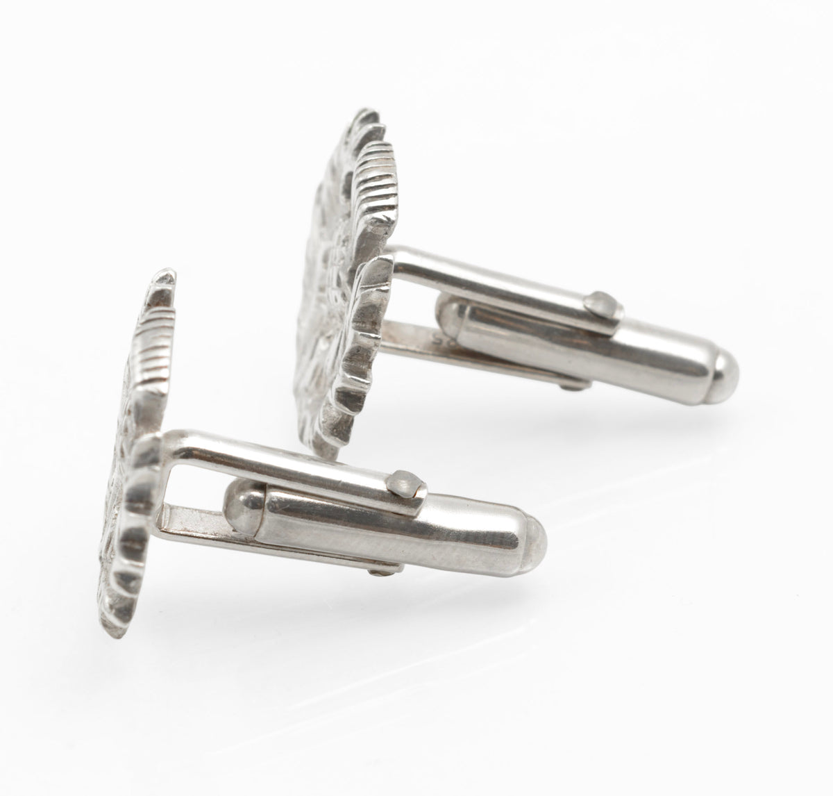 Side profile showing the relief depth of the silver thistle cufflink fronts