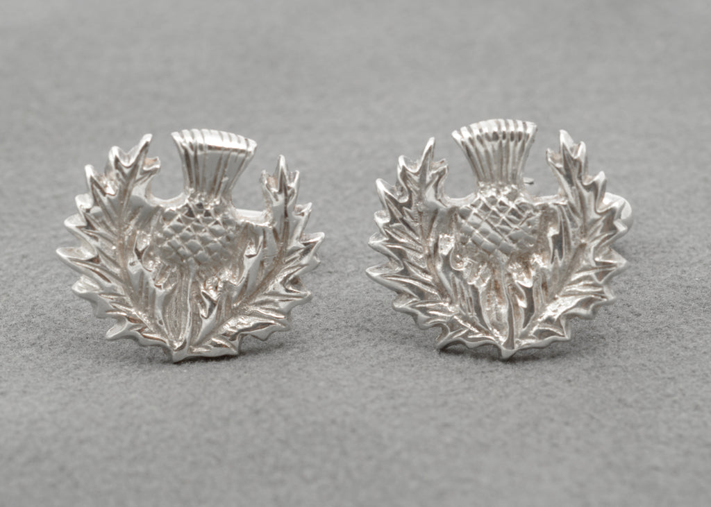 Pair of Scottish thistle cufflinks with detailed leaves and flower heads in relief