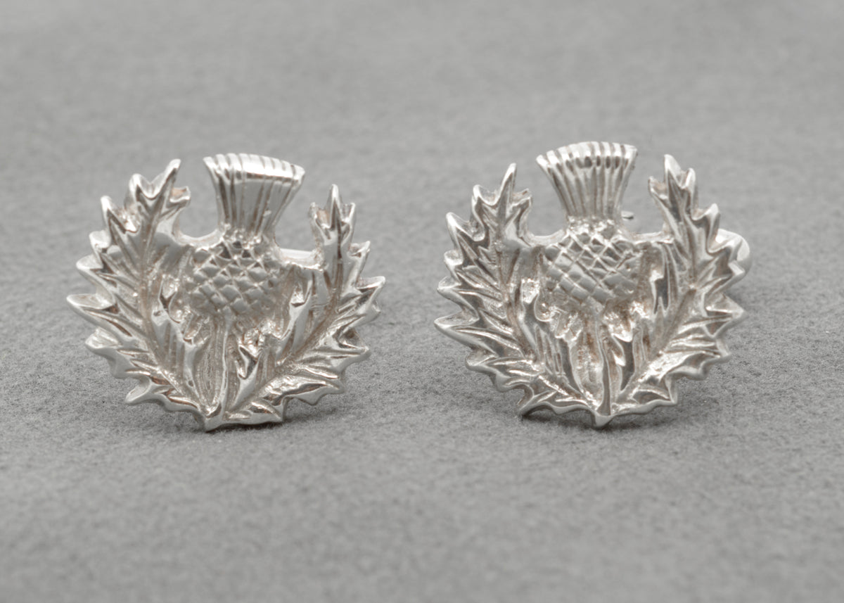 Pair of Scottish thistle cufflinks with detailed leaves and flower heads in relief