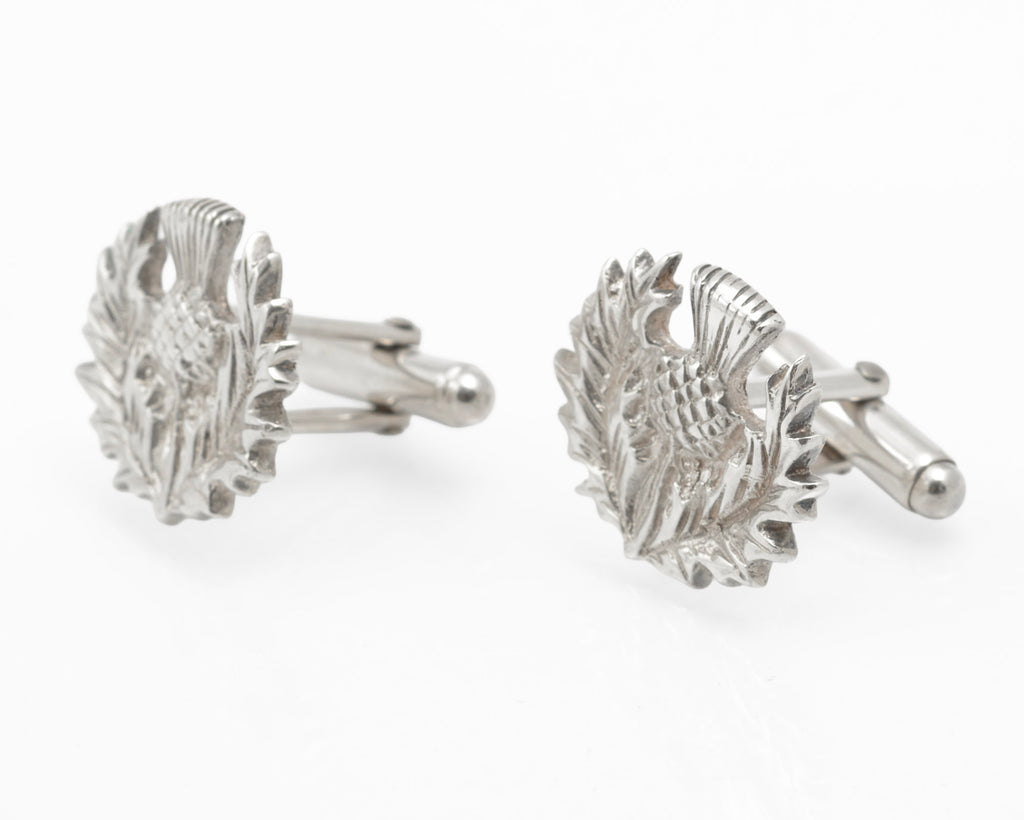 Angled view of the sculpted thistle heads and rotating toggle fittings