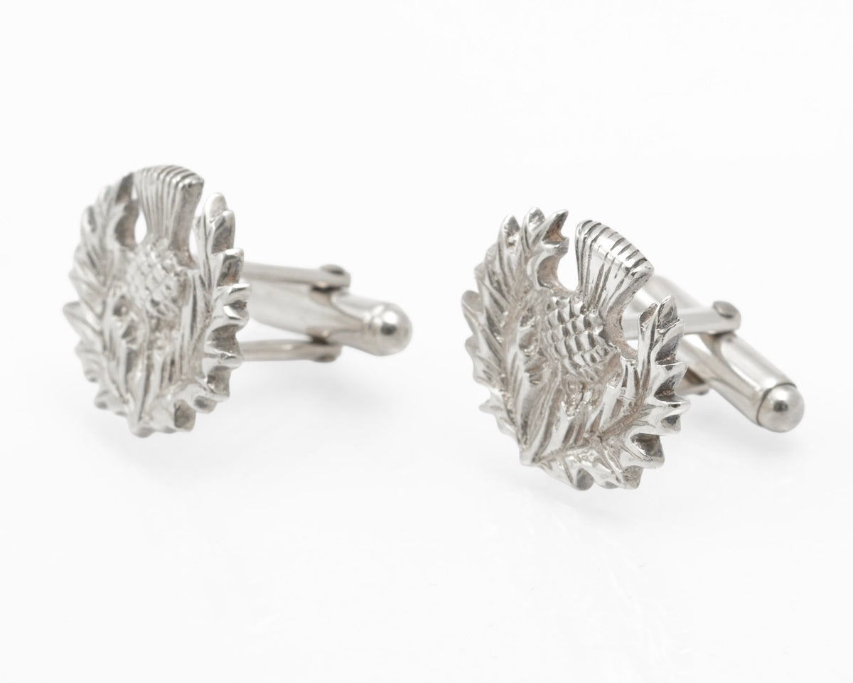 Angled view of the sculpted thistle heads and rotating toggle fittings