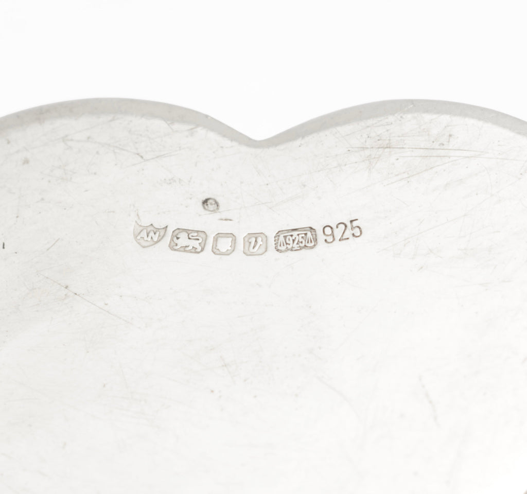 Close view of the Ari D Norman maker's mark, London hallmarks and 925 marks on the base