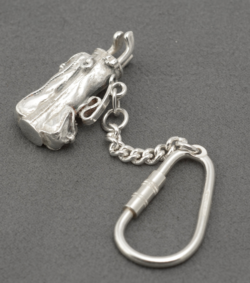Reverse angle of the sterling silver golf bag keyring and its connecting curb chain