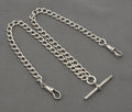 Edwardian silver double Albert watch chain coiled with central T bar and two swivel dog clips