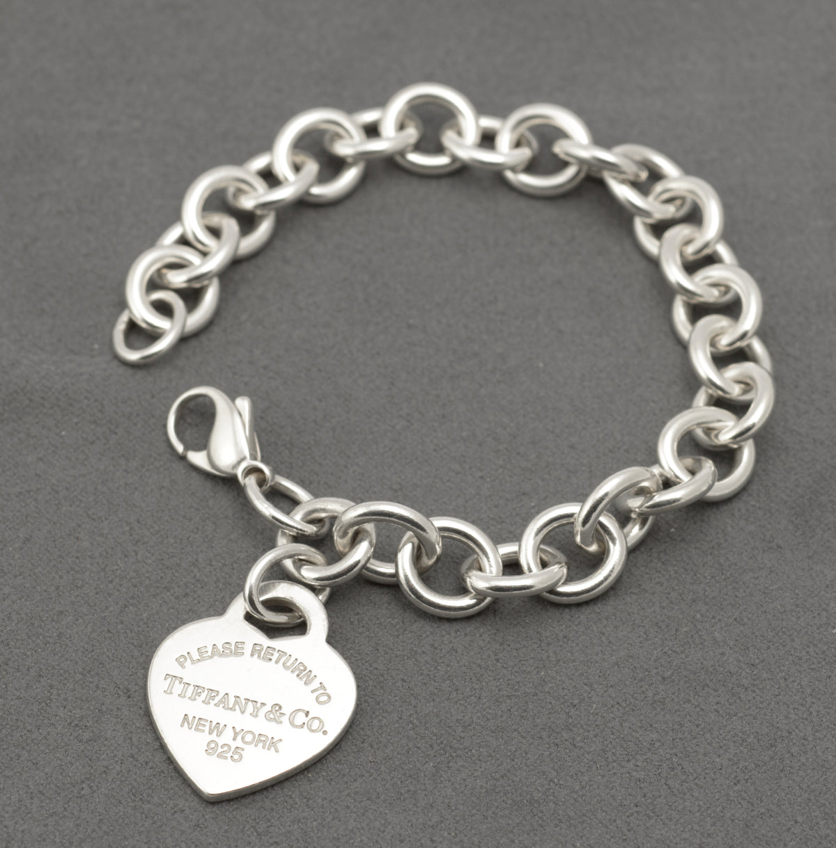 Return to Tiffany silver heart tag bracelet displayed on a mannequin wrist