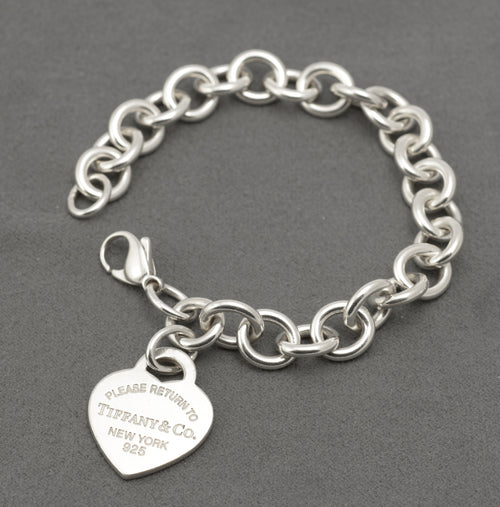 Return to Tiffany silver heart tag bracelet displayed on a mannequin wrist