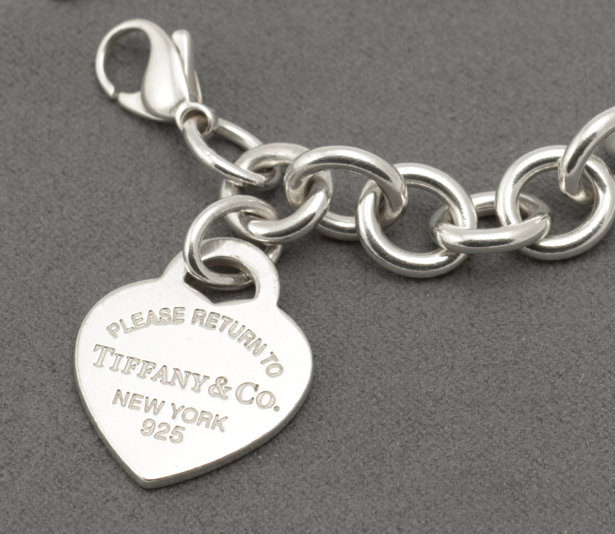 Reverse of the Tiffany silver heart tag showing Tiffany & Co Ag925 markings and hallmarks