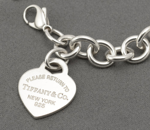Reverse of the Tiffany silver heart tag showing Tiffany & Co Ag925 markings and hallmarks