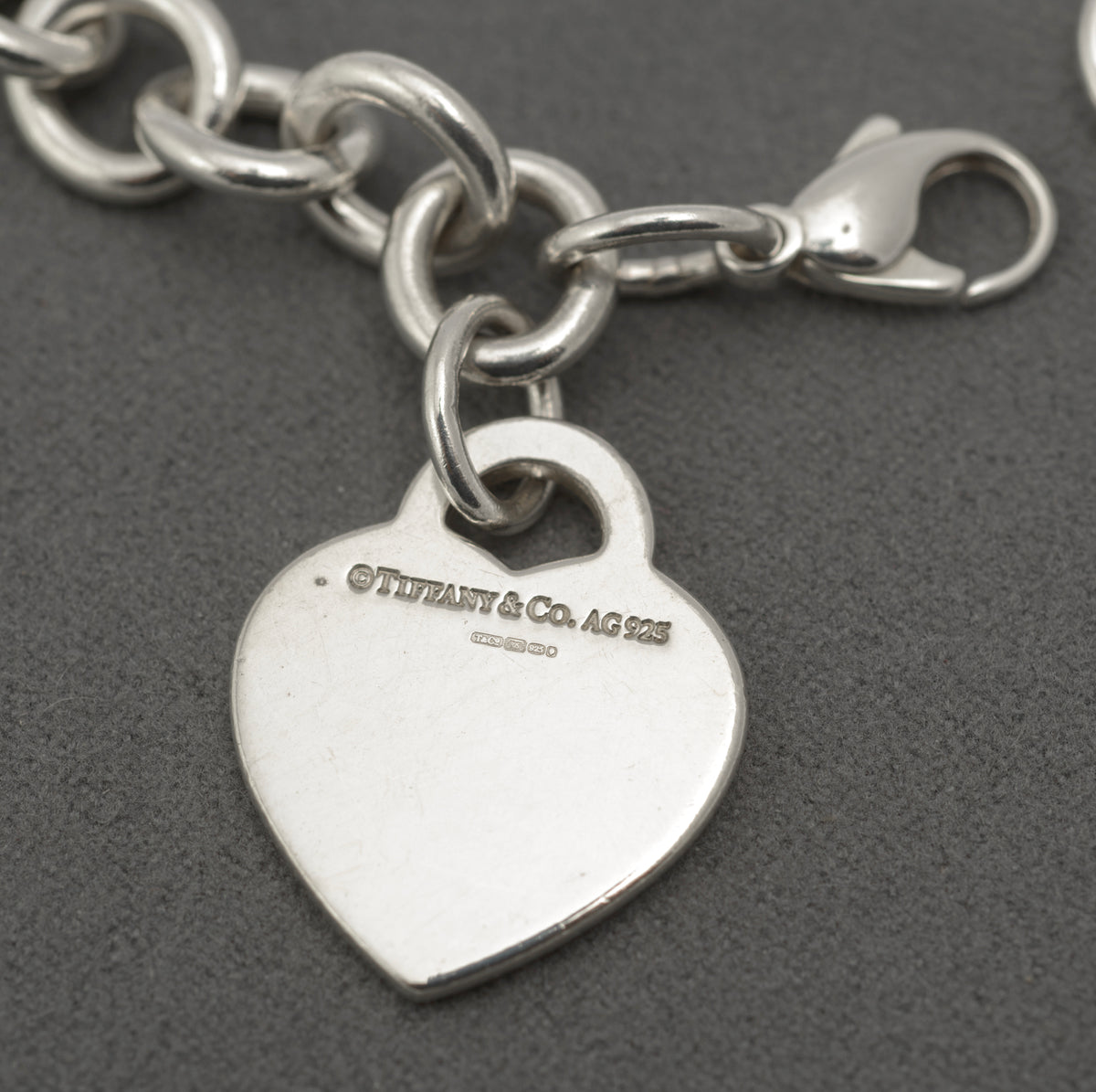 Close view of the Please Return to Tiffany & Co New York 925 engraving on the heart tag