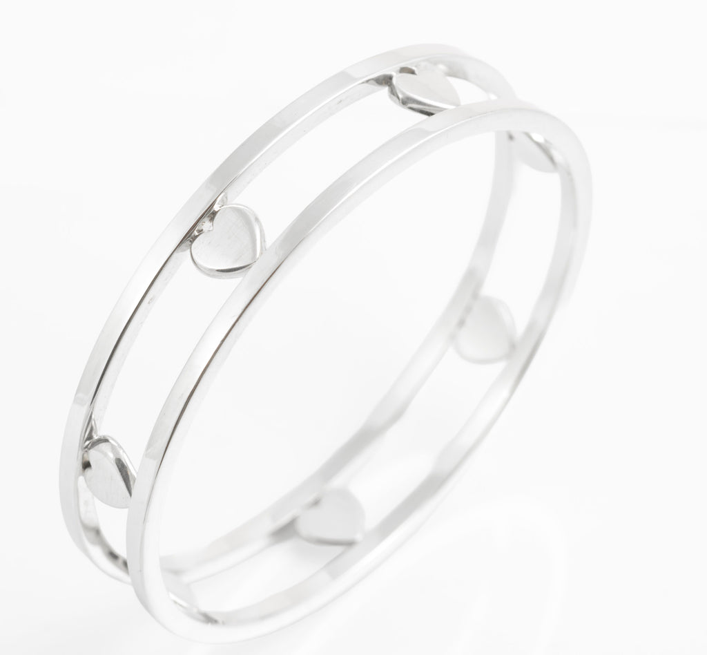 Tiffany Floating Heart bangle standing at an angle against white