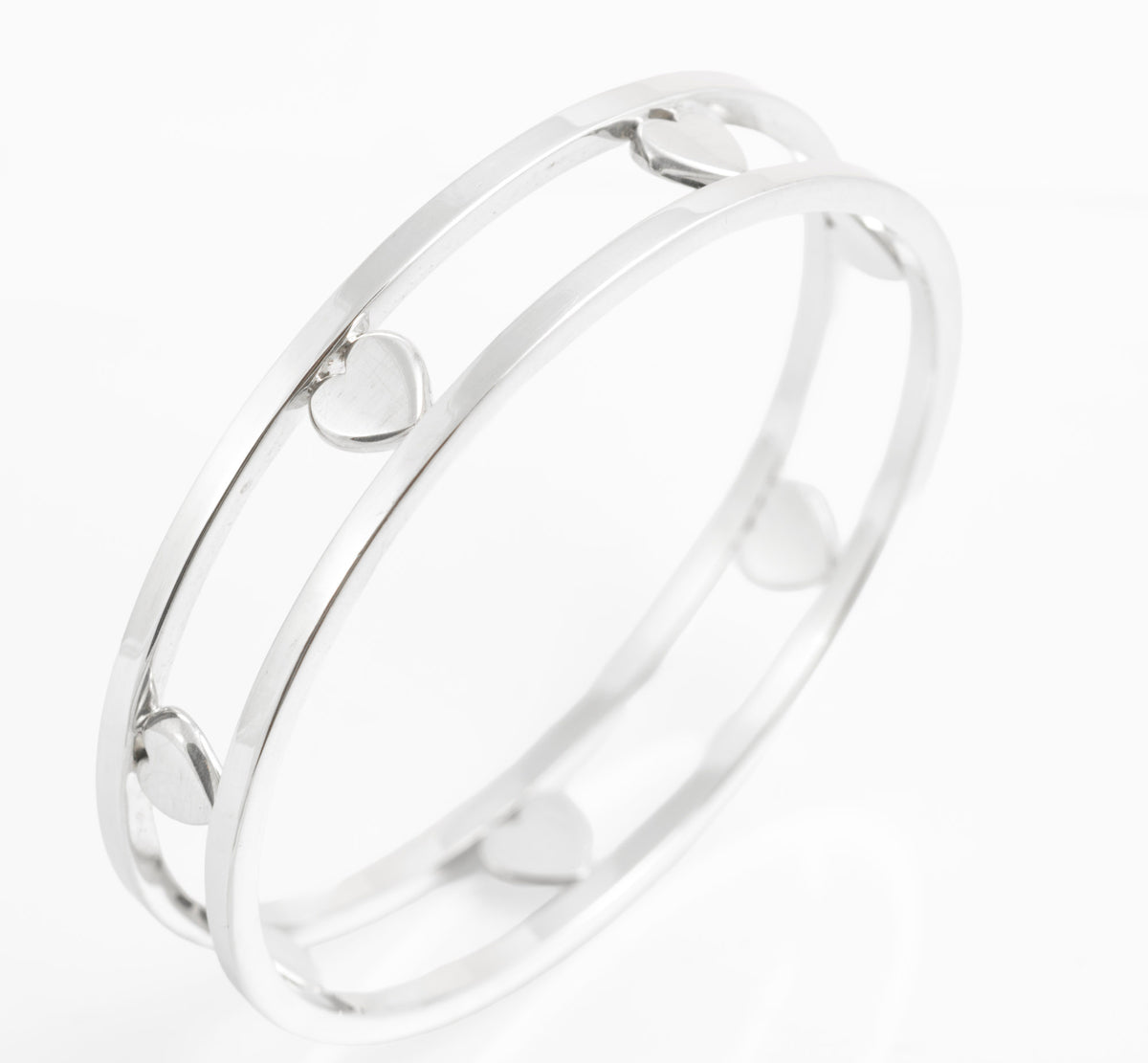 Tiffany Floating Heart bangle standing at an angle against white