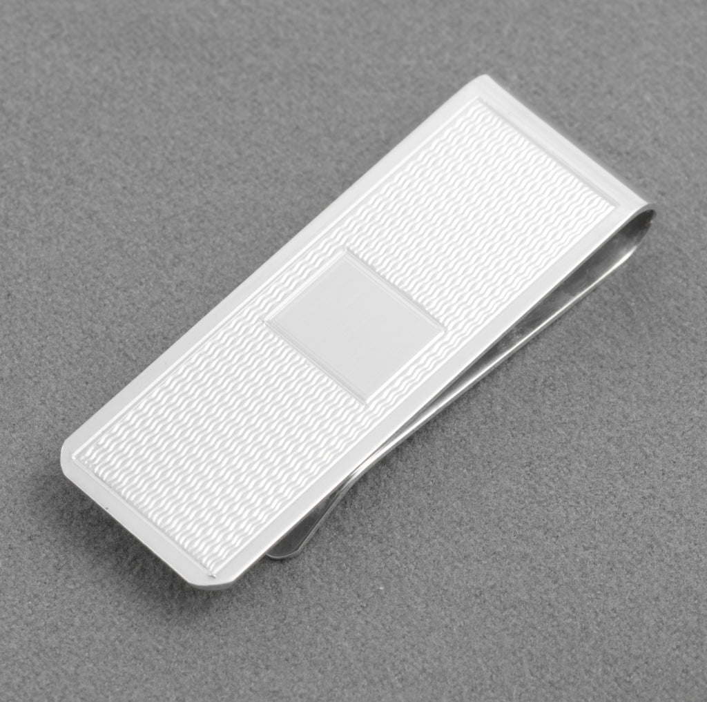 W H Manton sterling silver money clip with engine turned front and vacant rectangular cartouche