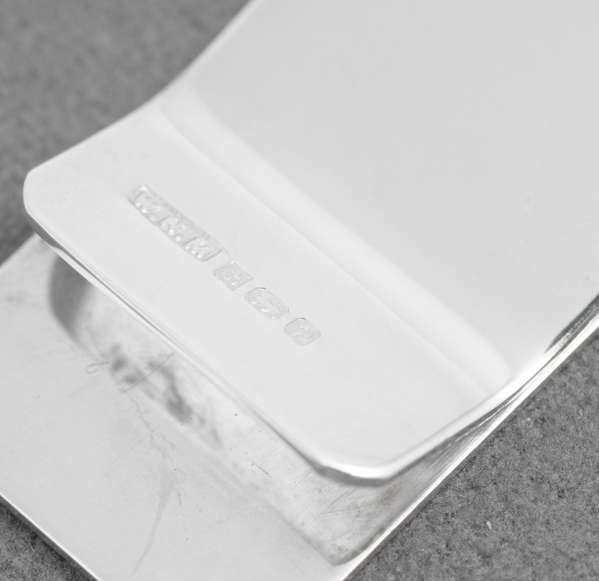 Plain polished reverse of the W H Manton silver money clip