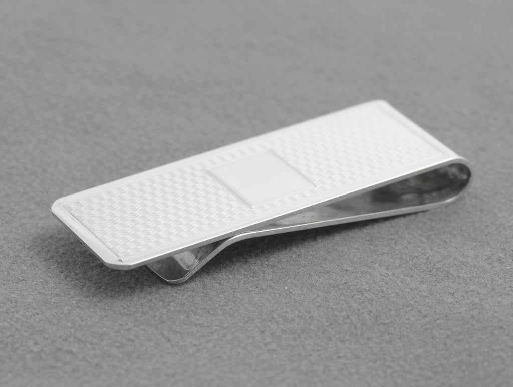 Side view showing the folded spring construction of the silver money clip