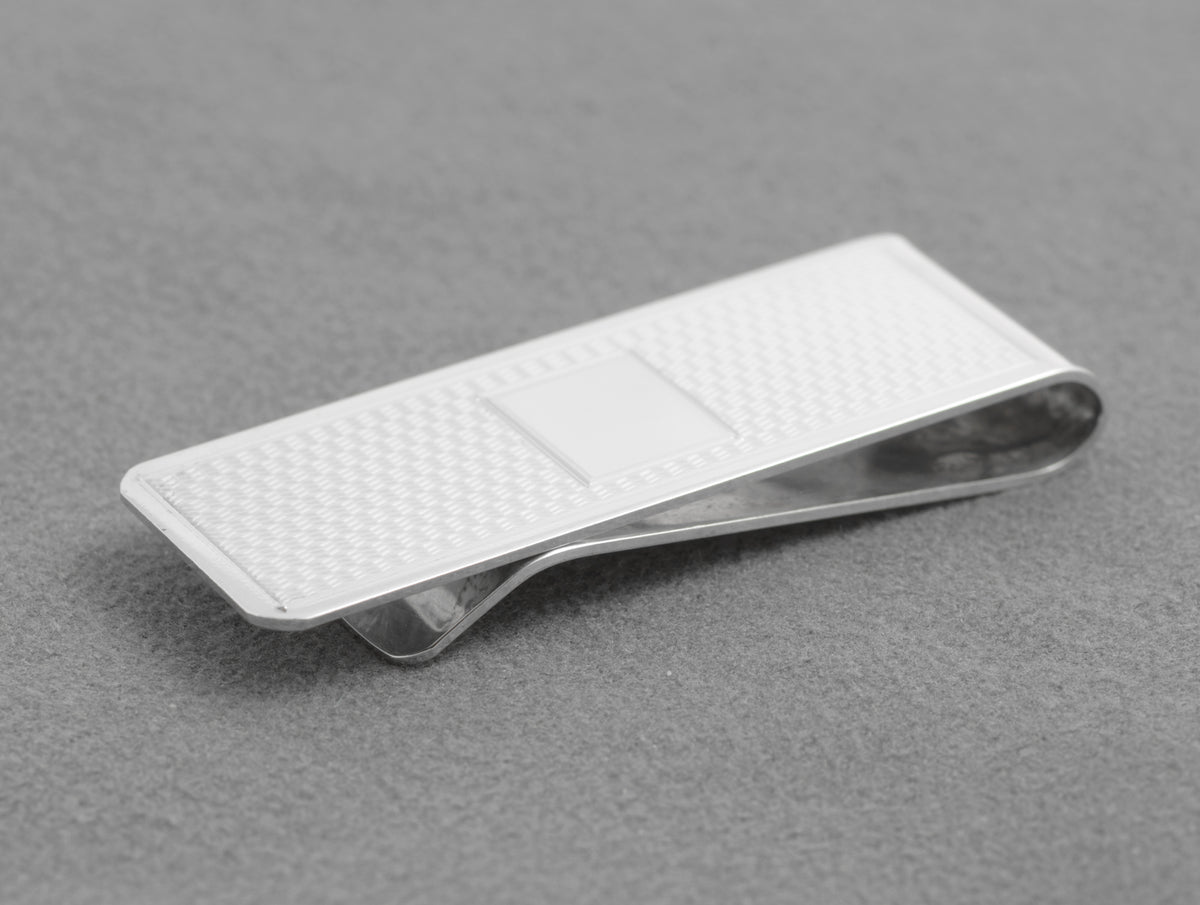 Side view showing the folded spring construction of the silver money clip