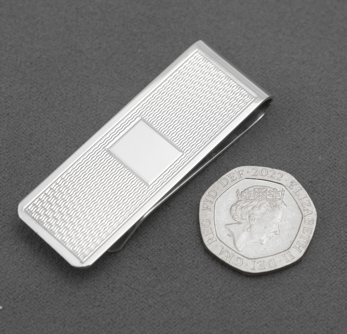 Close view of the Birmingham hallmark and maker's mark on the money clip