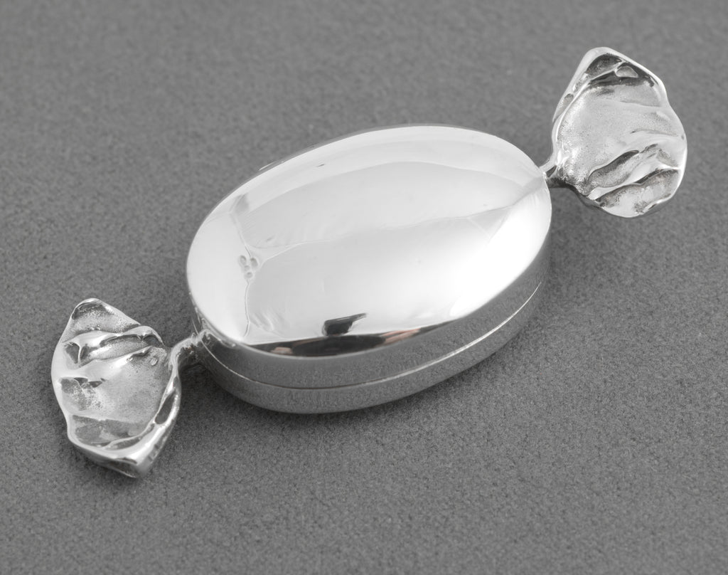 Angled view of the silver sweet shaped trinket box