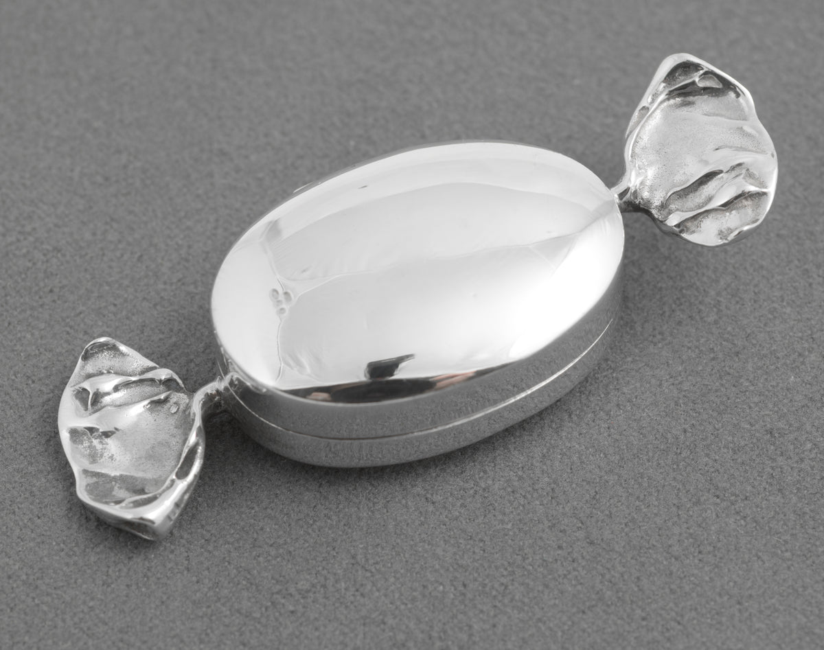 Angled view of the silver sweet shaped trinket box