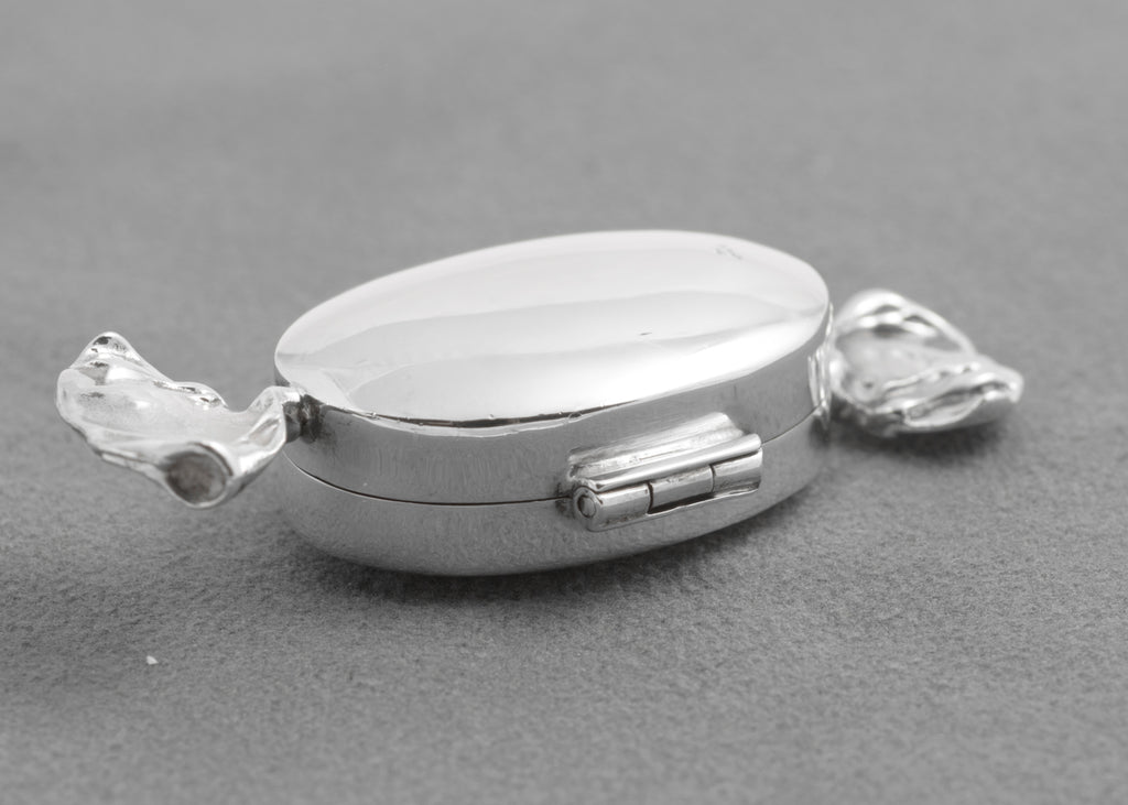 Open hinged lid and interior of the sterling silver sweet box