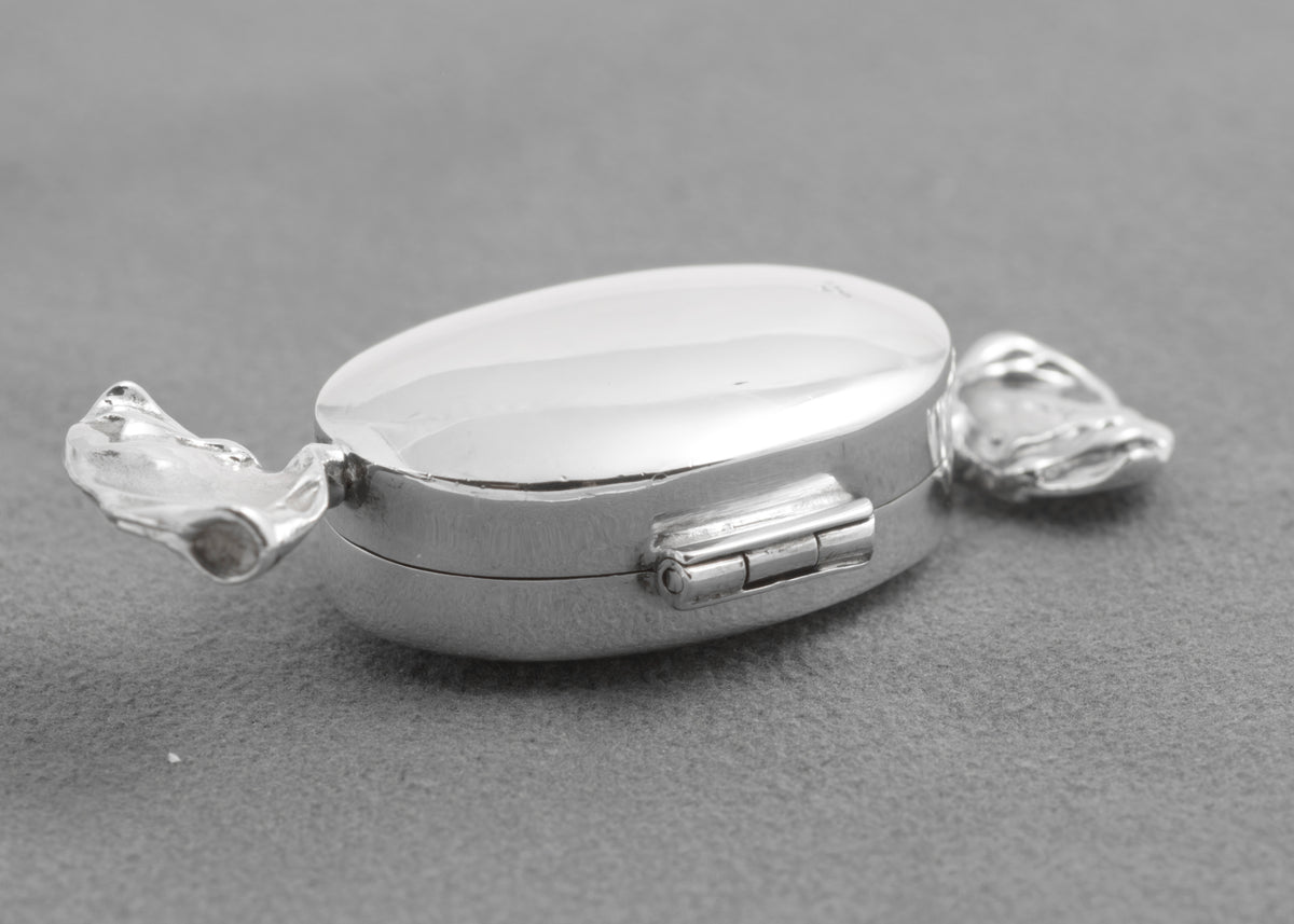 Open hinged lid and interior of the sterling silver sweet box